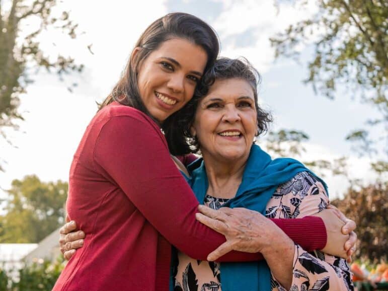 Senior mother and adult daughter hugging