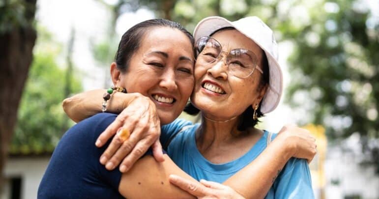 Two people embracing and smiling