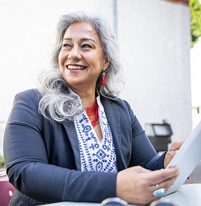 Smiling woman looking at tablet